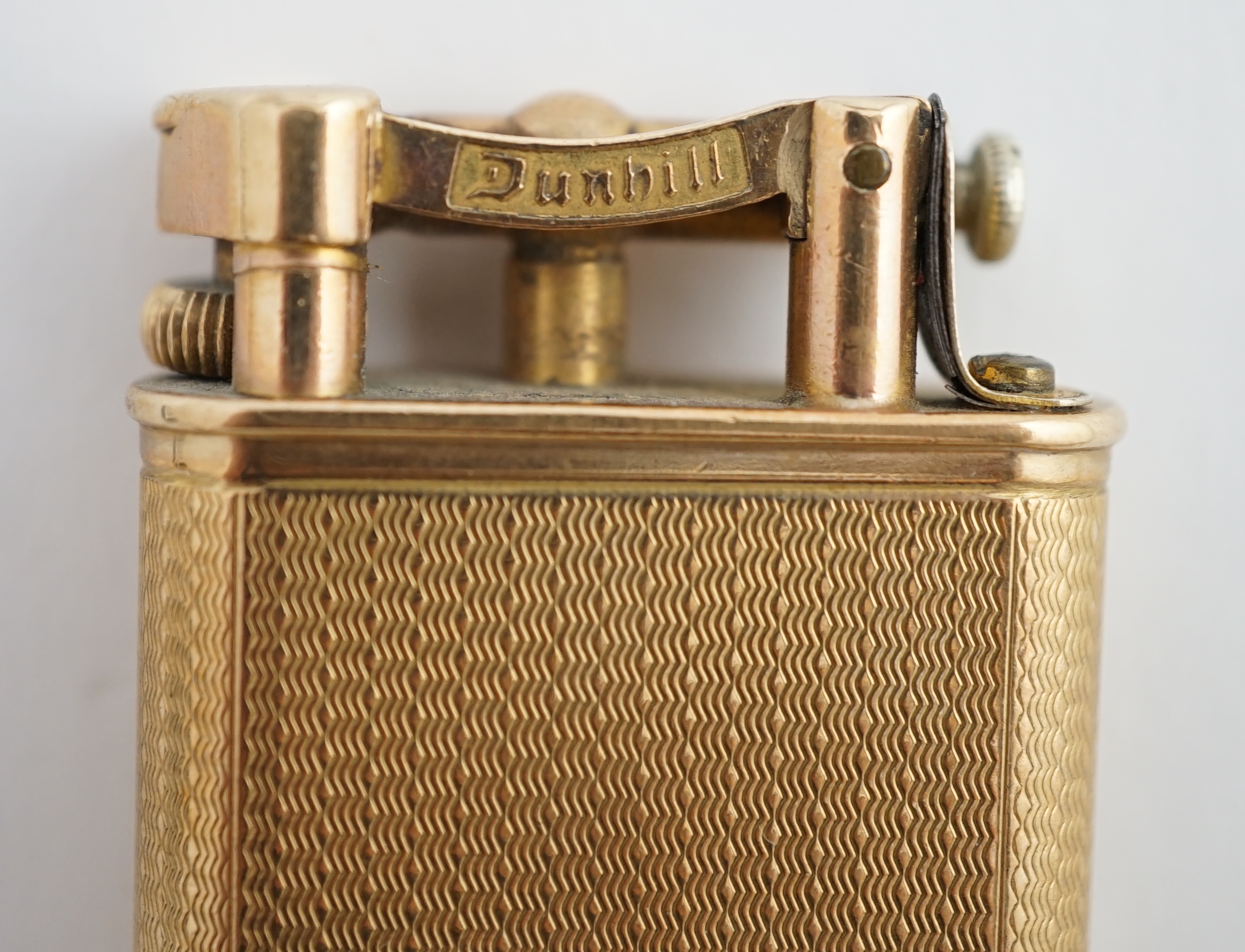 A George V engine turned 9ct gold cased Dunhill lighter